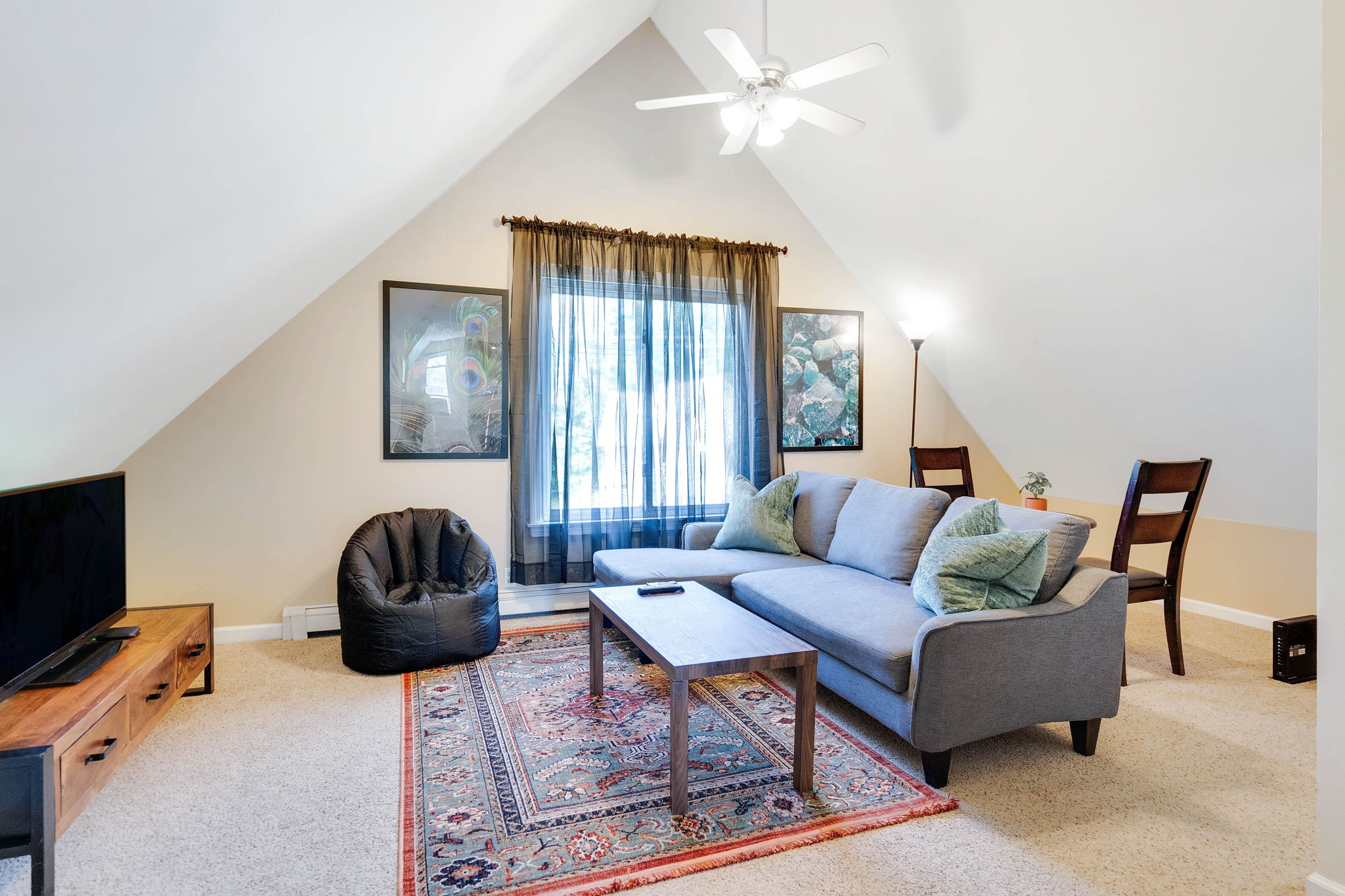 Vaulted-ceiling living room with sectional and afternoon light